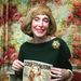 Long-time Cosmopolitan Editor-In-Chief Helen Gurley Brown poses on her desk during an interview in her New York office Monday, Jan. 20, 1997. 