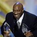 In this Sunday, Jan. 7, 2001 file photo, actor Michael Clarke Duncan accepts two awards for the film "The Green Mile" at the 27th Annual People's Choice Awards in Pasadena, Calif. Duncan has died at the age of 54 on Monday, Sept. 3, 2012 in a Los Angeles hospital after nearly two months of treatment following a July 13, 2012 heart attack, his fiancee, the Rev. Omarosa Manigault, said. 