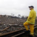 A firefighter stands on a rail line and surveys the remains of a fertilizer plant destroyed by an explosion in West, Texas, Thursday, April 18, 2013. A massive explosion at the West Fertilizer Co. killed as many as 15 people and injured more than 160, officials said overnight. 