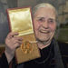 In this Wednesday, Jan. 30, 2008 file photo, Nobel literature laureate, Doris Lessing holds up the 2007 Nobel Prize for Literature medal after being presented it by the Ambassador of Sweden, Staffan Carlsson, during a ceremony at the Wallace Collection art gallery in London. Doris Lessing, the free-thinking, world-traveling, often-polarizing writer of "The Golden Notebook" and dozens of other novels that reflected her own improbable journey across the former British empire, has died, early Sunday, Nov. 17, 2013. She was 94. The author of more than 50 works of fiction, nonfiction and poetry, Lessing explored topics ranging from colonial Africa to dystopian Britain, from the mystery of being female to the unknown worlds of science fiction. 