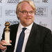 Philip Seymour Hoffman poses with the award he won for best actor in a drama for his work in "Capote," at the 63rd Annual Golden Globe Awards on Monday, Jan. 16, 2006, in Beverly Hills, Calif. 