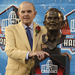 Founder and owner of the Buffalo Bills, Ralph Wilson Jr., stands with his bronze bust during the Pro Football Hall of Fame induction ceremony at the Pro Football Hall of Fame, Saturday, Aug. 8, 2009, in Canton, Ohio. Wilson is part of the Class of 2009. 