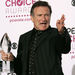 Robin Williams holds his favorite funny male star award at the 33rd Annual People's Choice Awards on Tuesday, Jan. 9, 2007, in Los Angeles. (AP Photo/Reed Saxon)