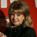 In this Monday, Sept. 30, 2013 file photo, Mandy Rice Davies, former model and showgirl, right, poses with actress Charlotte Blackledge, who plays her in the new Andrew Lloyd Webber musical 'Stephen Ward', during the show launch photocall, in London. Mandy Rice-Davies, a key figure in Britain's biggest Cold War political scandal, the "Profumo Affair," has died. She was 70. Her PR firm said Friday Dec. 19, 2014, that Rice-Davies died Thursday evening "after a short battle with cancer." (AP Photo/Sang Tan, File)