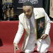 FILE - In this June 4, 2004 file photo, Grammy-winning gospel singer Andrae Crouch poses for a photo at a ceremony honoring him with the 2,256nd star on the Hollywood Walk of Fame in Los Angeles. Crouch, a legendary gospel performer, songwriter and choir director whose work graced songs by Michael Jackson and Madonna and movies such as "The Lion King," has died at age 72. His publicist says Crouch died Thursday, Jan. 8, 2015, at a hospital in Los Angeles, where he was admitted Saturday after suffering a heart attack. (AP Photo/Nick Ut, File)