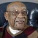 In this Nov. 13, 2014, file photo former PGA golfer Charlie Sifford talks during an interview at his home in Brecksville, Ohio. Sifford, who fought the Caucasian-only clause on the PGA Tour and became its first black member has died Monday night Feb. 2, 2015. He was 92. The PGA of America confirmed the death of Sifford, who recently suffered a stroke. No cause of death was given. (AP Photo/Mark Duncan)