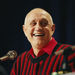 In this April 2, 1990, file photo UNLV head coach Jerry Tarkanian flashes a big smile during a press conference prior to facing Duke in the NCAA Final Four in Denver. Hall of Fame coach Jerry Tarkanian, who built a basketball dynasty at UNLV but was defined more by his decades-long battle with the NCAA, died Wednesday, Feb. 11, 2015, in Las Vegas after several years of health issues. He was 84. (AP Photo/Eric Risberg, File)