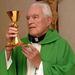 The Rev. Theodore Hesburgh, C.S.C, president emeritus of the University of Notre Dame, raises the chalice during mass in the chapel in his office at the Hesburgh Library on the campus of the University of Notre Dame in South Bend, Ind. Oct. 5, 2007. Hesburgh is 90 years old now, but still comes to his office in the library named after him nearly every day to visit with students, alumni and anyone else who wants to stop by for some advice, to chat or to hear a piece of the history he has seen. (AP Photo/Joe Raymond)