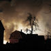  Smoke rises from a burning plane after it crashed into a house in Clarence Center, N.Y., Thursday Feb. 12, 2009. New York state police say a Continental Flight 3407 from Newark, N.J., a 50-passenger commuter plane, has crashed into a home in suburban Buffalo.