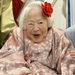 Misao Okawa, 115, who is recognized as the world's oldest living woman by Guinness World Records poses on the Doll Festival in Osaka, western Japan Monday, March 3, 2014. (AP Photo/Kyodo News)