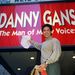 In this Sept. 27, 1995 file photo, Danny Gans dusts off the marquee of New York's Neil Simon Theater, which hosts his one-man show, "Danny Gans: The Man of Many Voices". 