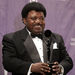 In this March 14, 2005 file photo, Percy Sledge holds up a trophy back stage after being inducted into the Rock and Roll Hall of Fame at an induction ceremony in New York. Sledge, who recorded the classic 1966 soul ballad "When a Man Loves a Woman," died, Tuesday April 14, 2015. He was 74. (AP Photo/Ed Betz, File)