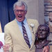 Former pro football player Bob St. Clair poses with his bust after being inducted into the Pro Football Hall of Fame in Canton, Ohio, Aug. 4, 1990. (AP Photo/Jeff Glidden)