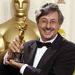 In this March 24, 2002 file photo, Andrew Lesnie poses with his Oscar trophy for cinematography for the film "Lord of the Rings: The Fellowship of the Rings" during the 74th annual Academy Awards in Los Angeles. Oscar-winning Australian cinematographer Lesnie, best known for his work on "The Lord of the Rings," has died, friends and colleagues said Wednesday, April 29, 2015. He was 59. (AP Photo/Doug Mills, File)