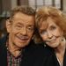 In this Nov. 6, 2003, file photo, Jerry Stiller, left, and his wife Anne Meara pose on the set of "The King of Queens," at Sony Studio in Culver City, Calif. Meara, whose comic work with Stiller helped launch a 60-year career in film and TV, has died. She was 85. Jerry Stiller and son Ben Stiller say Meara died Saturday, May 23, 2015. (AP Photo/Stefano Paltera, File)