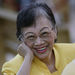 In this Sunday Aug. 17, 2008 file picture, cancer-stricken former Philippine President Corazon Aquino smiles to friends inside the church at the Ateneo de Manila University in suburban Quezon City, Philippines.