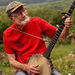 Pete Seeger, who turned 85 in May 2004, sits on his porch above the Hudson River at Beacon, N.Y. and plays a Woody Guthrie song on his banjo on Tuesday, July 27, 2004.