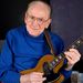 In this Feb. 26, 2007 file photo, Guitar legend Les Paul smiles at the Iridium Jazz Club in the Manhattan Borough of New York. Paul, 94, the guitarist and inventor who changed the course of music with the electric guitar and multitrack recording and had a string of hits, has died