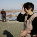 A resident wipes tears as she finds no remains of her home, Monday, March 14, 2011, in Soma city, Fukushima prefecture, Japan, three days after a massive earthquake and tsunami struck the country's northeast coast. 